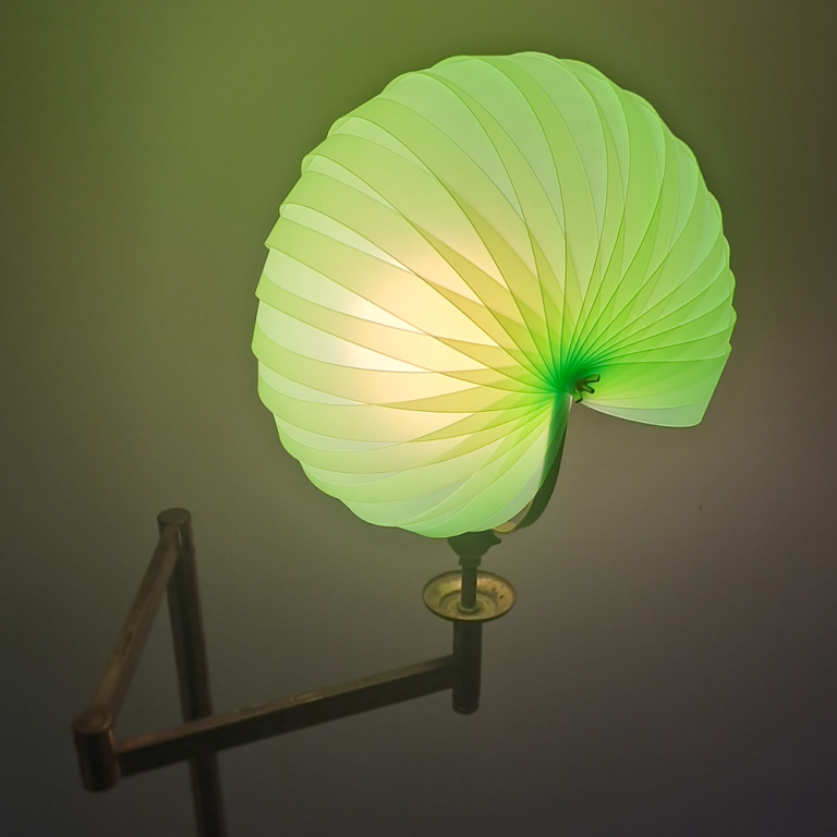 parametric lampshade constructed from green lasercut Priplak strips